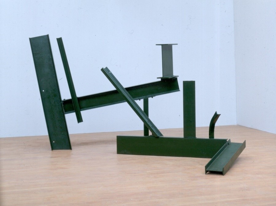 Anthony Caro Sculpture Two from 1962 featuring place metal I-Beams in green on museum floor