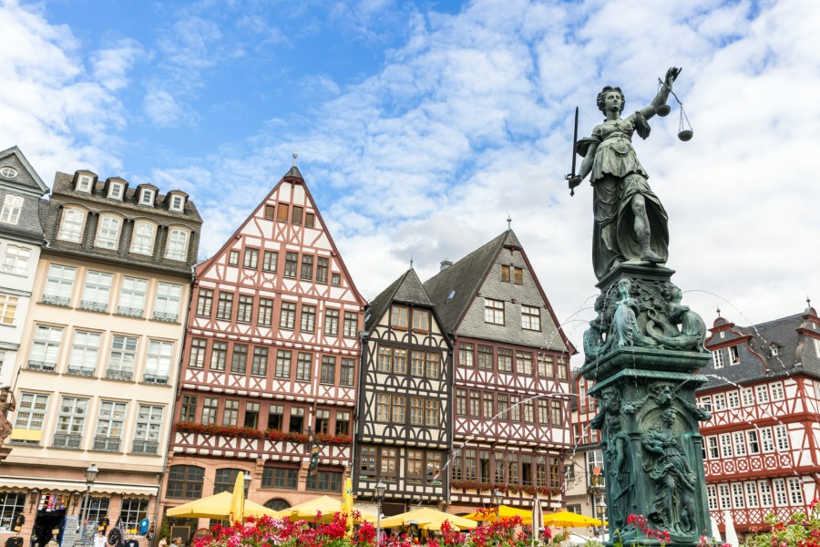 Romerburg Town Square with statue in foreground in Frankfurt Germany
