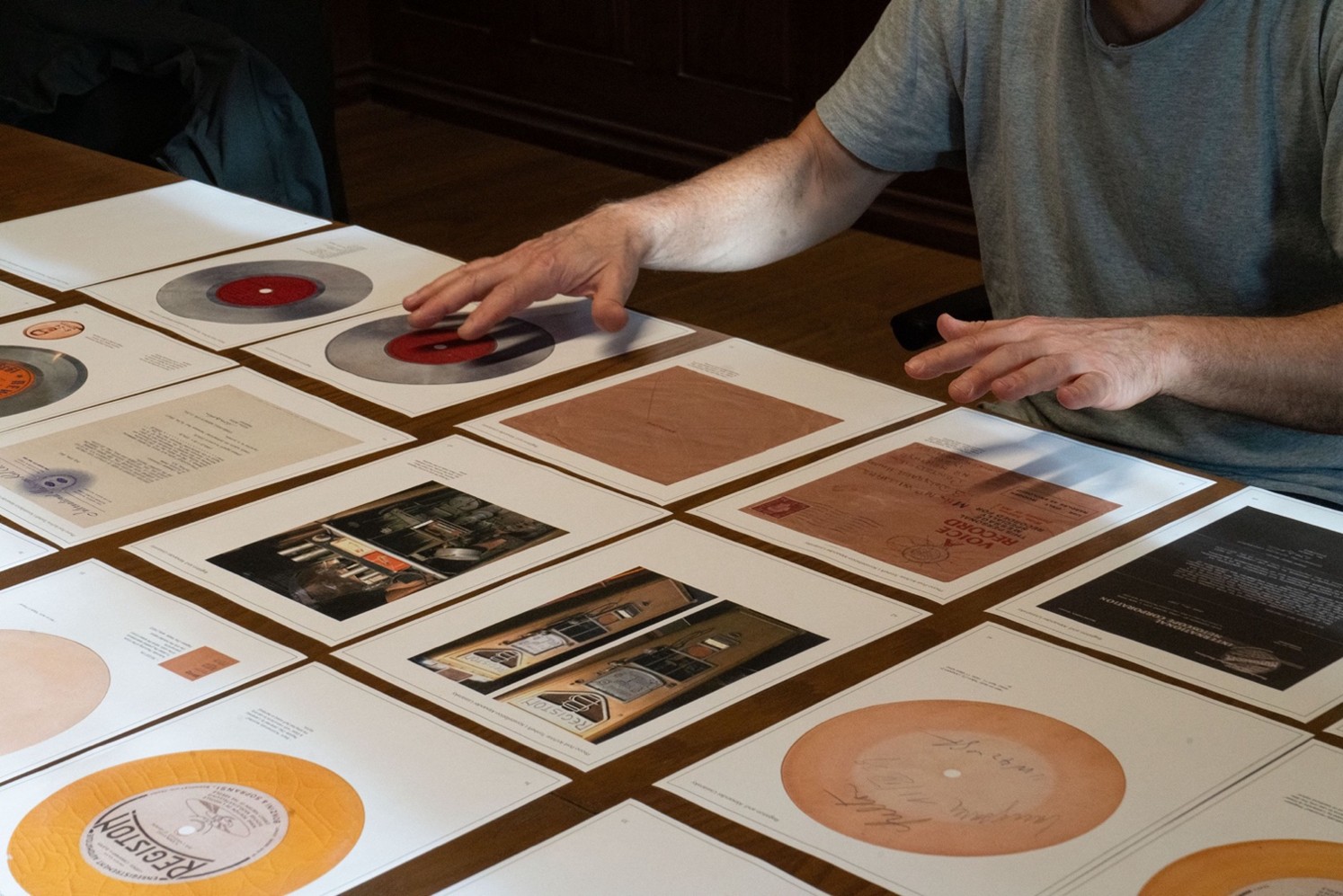 Closeup of hands on images of media