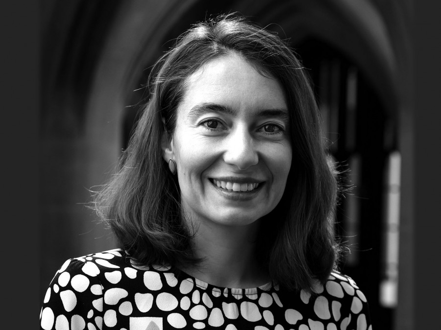 Portrait of woman standing in gothic archway