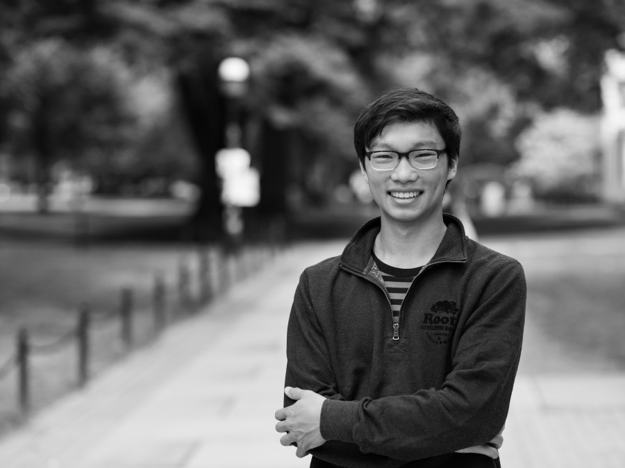 Student smiling with Princeton University campus in background