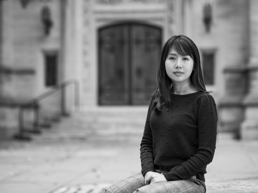 Student posing with Princeton Catherdral steps in background