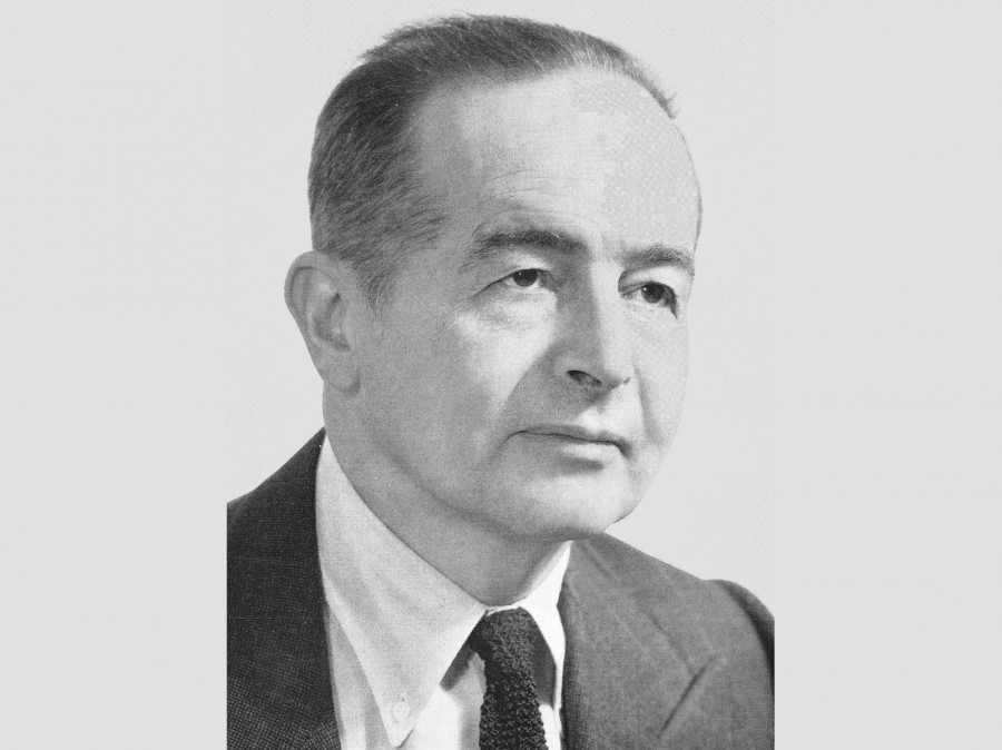Black and white portrait image of Eric Auerbach in jacket and tie