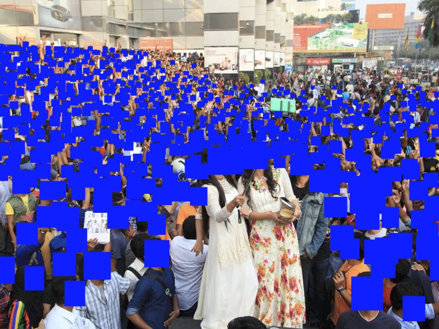 Crowd of people with faces digitally covered with blue squares
