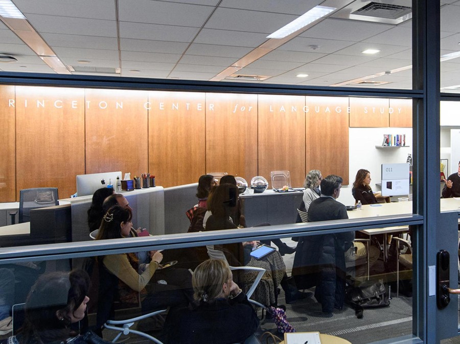 Princeton center for languages event room with people sitting at table in a discussion