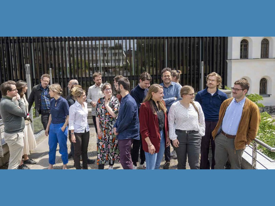 Group of people standing outside in gathering of conversation