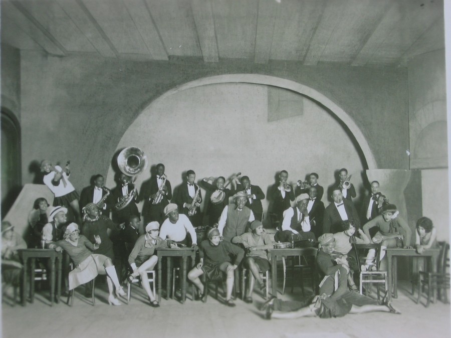 Large group of musicians and performers posed in photo from Berlin in the 1920s