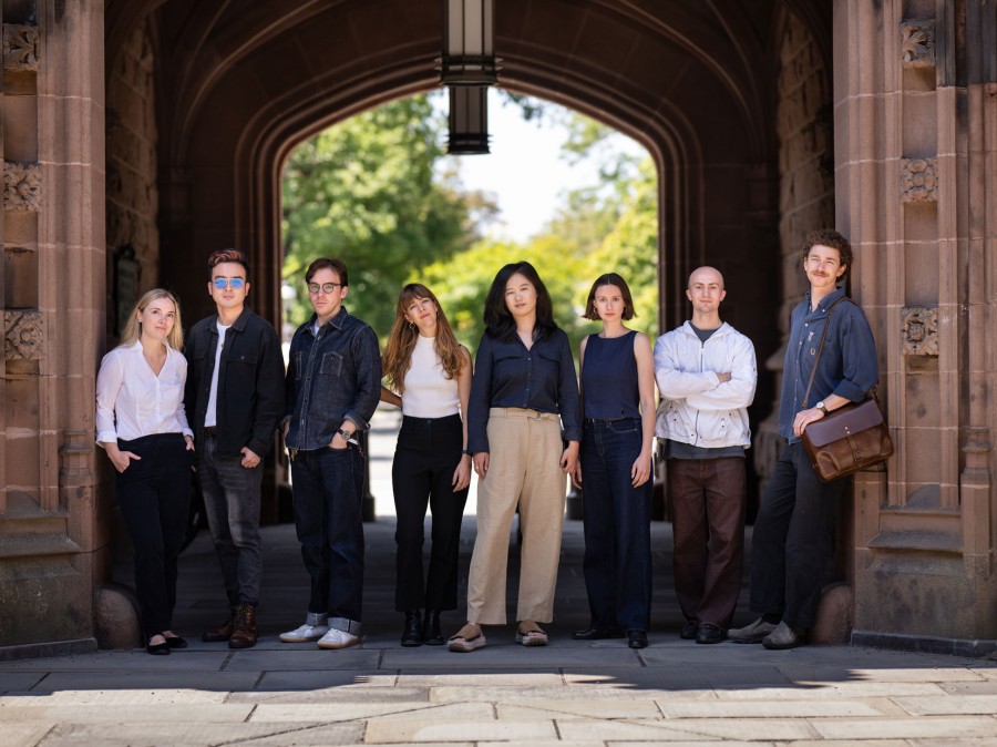 German department Graduate Students standing under East Pyne Archway