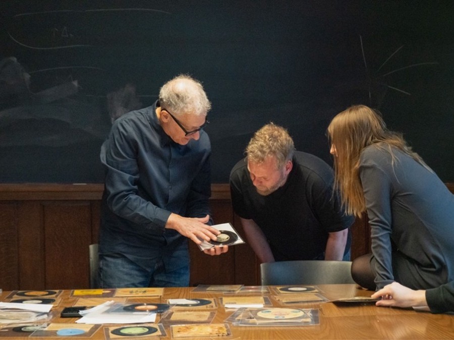 Faculty member demonstrating media to graduate students