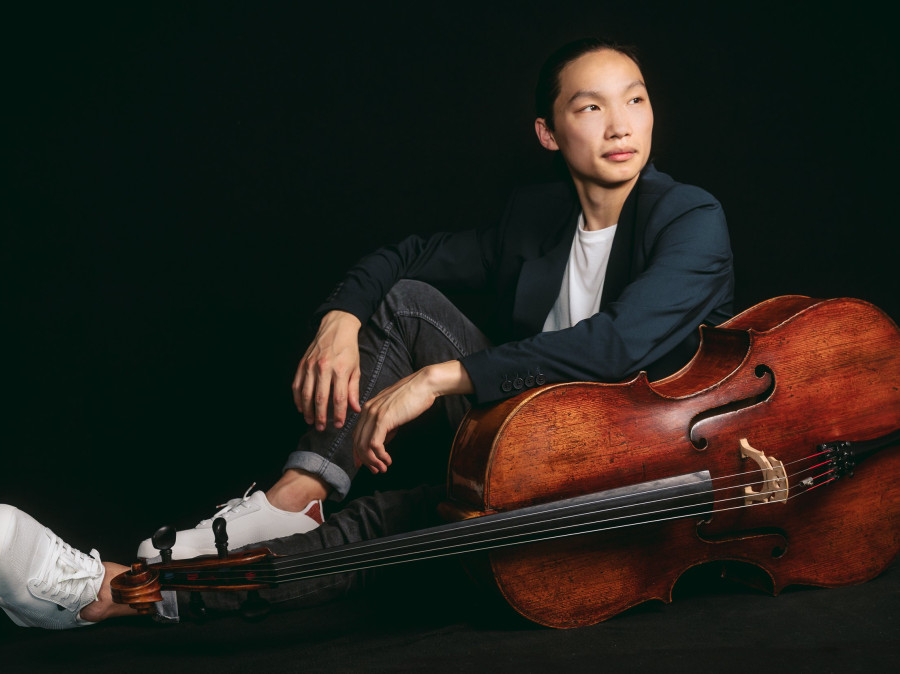 Leland Ko sitting posed with his cello.